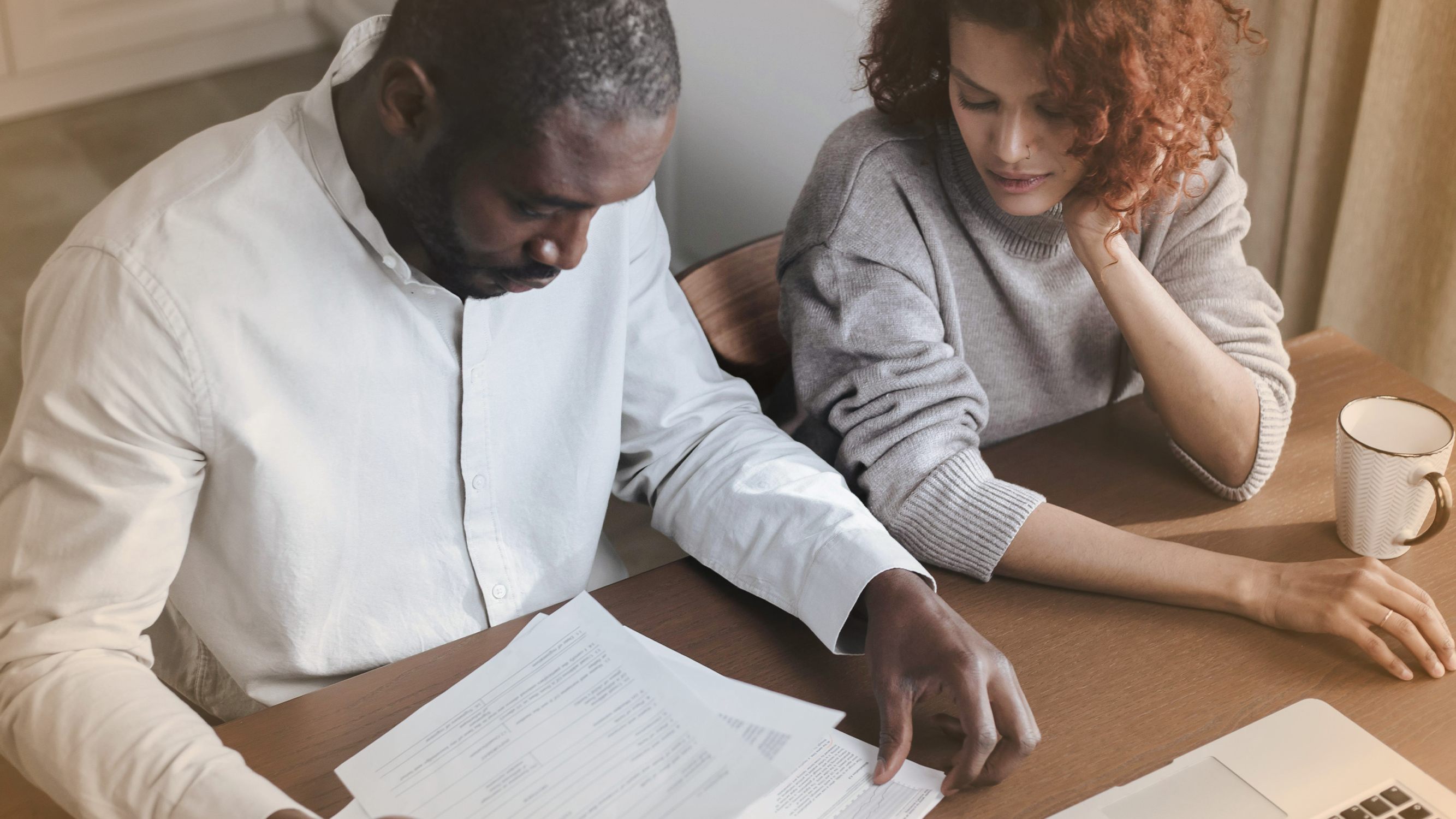 Couple reviewing financial documents