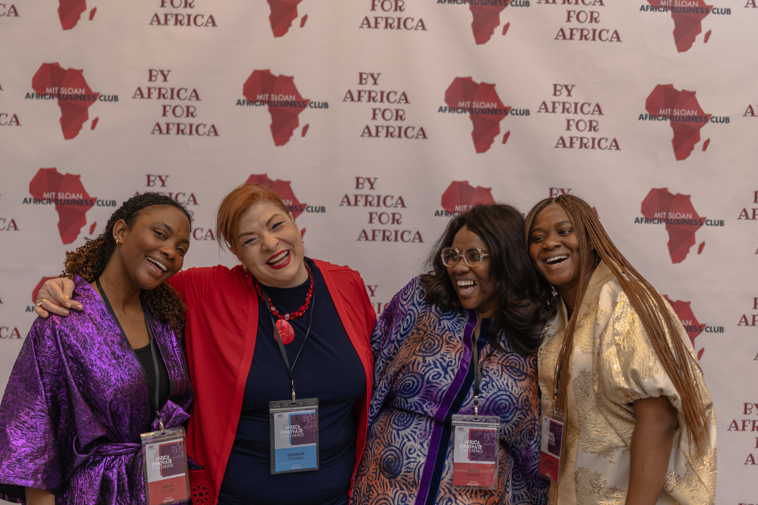 Three students and Interim Dean Georgia Perakis at the Africa Innovate Conference 