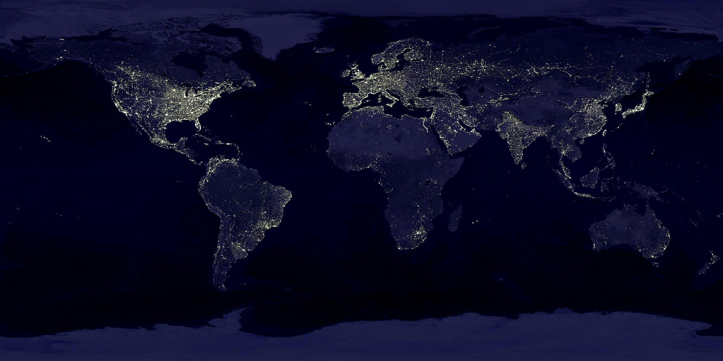 world map darkened at night with lights