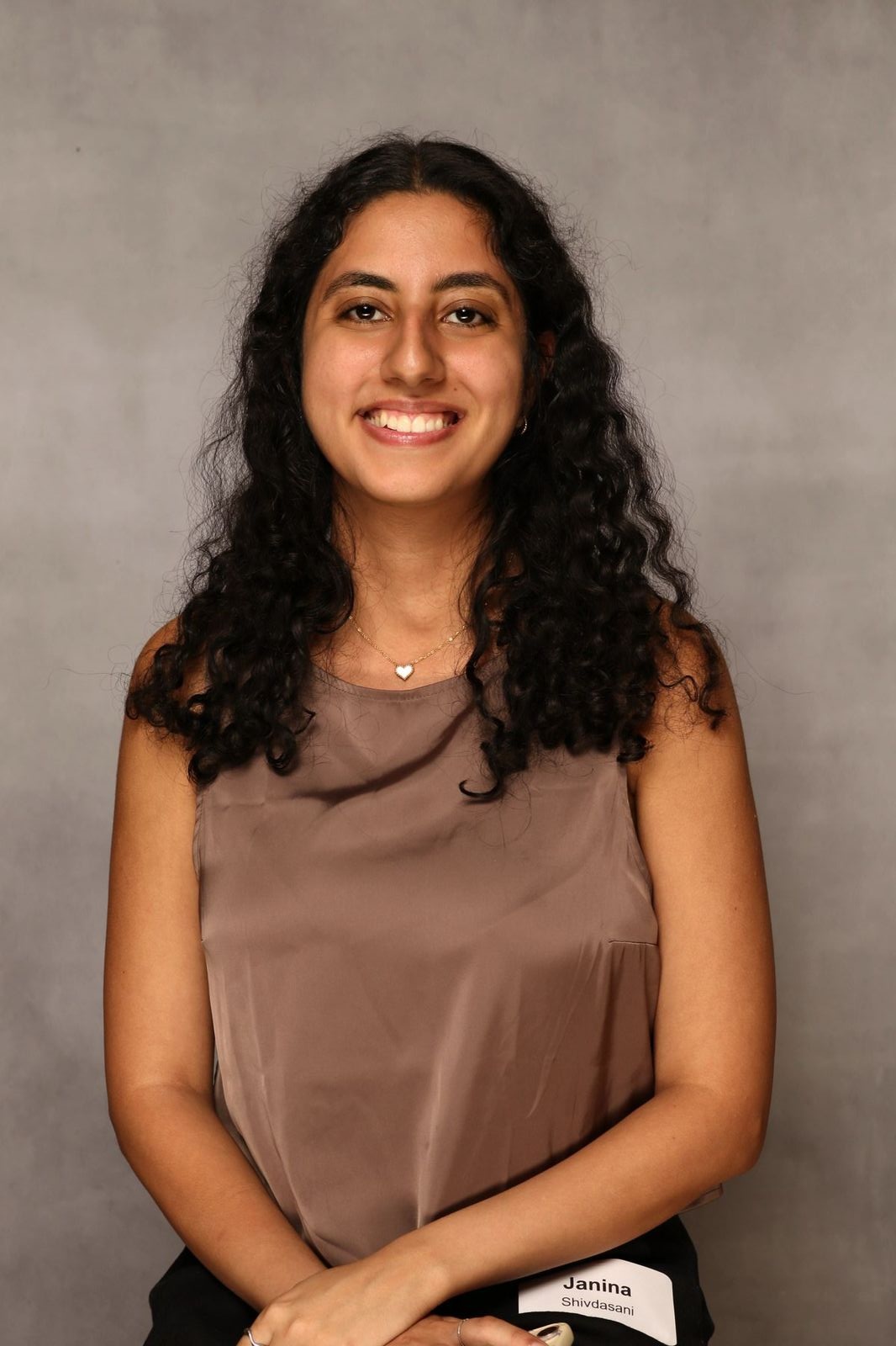 Headshot of a woman on a grey background