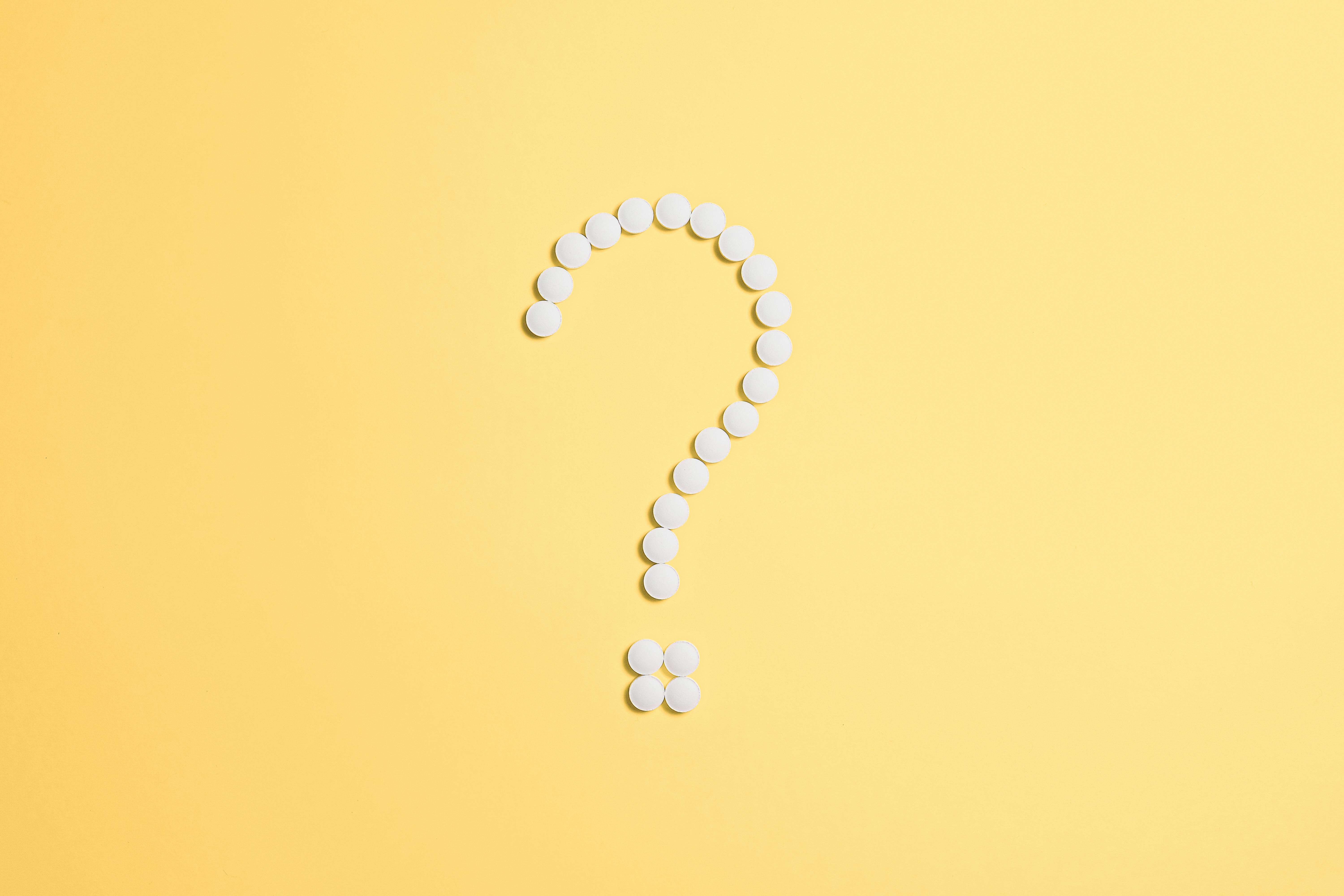 white question mark on a yellow background