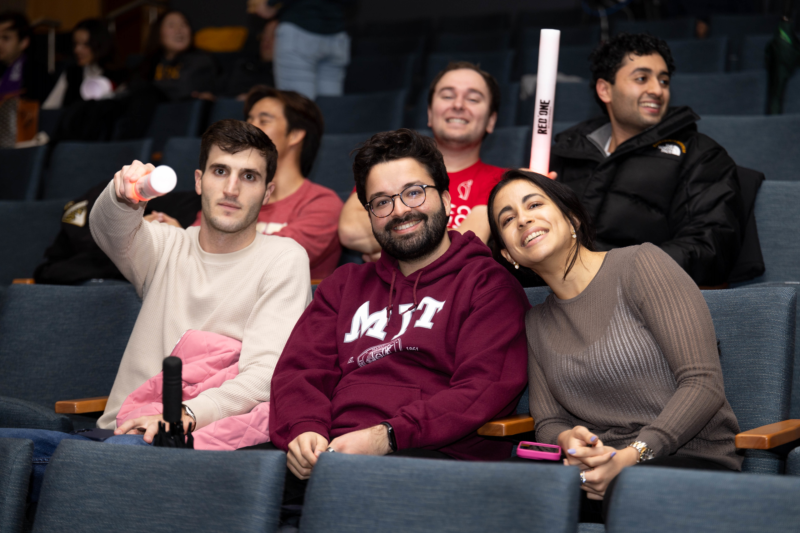 A group of six students sitting in a theater