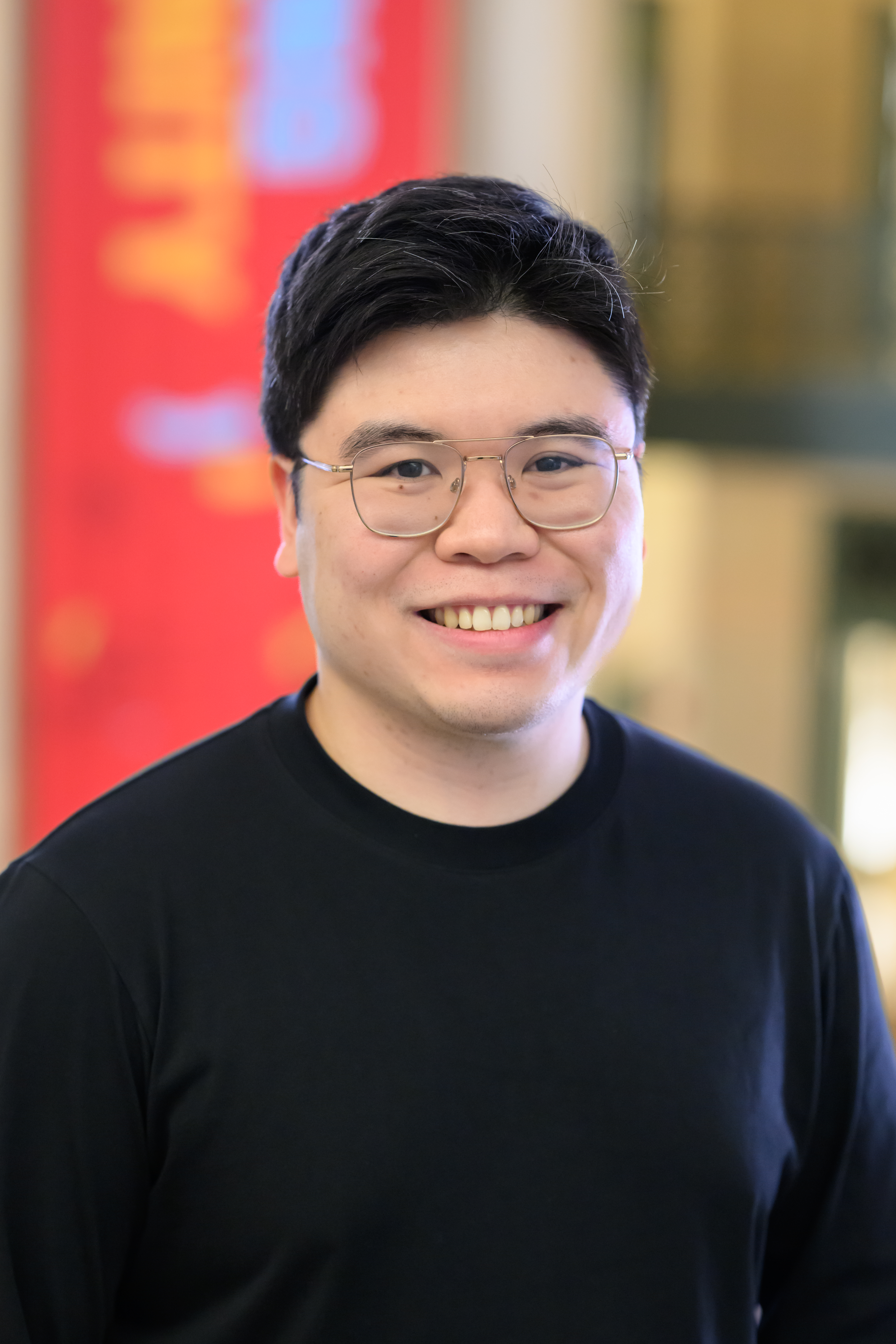 Headshot of a man in glasses