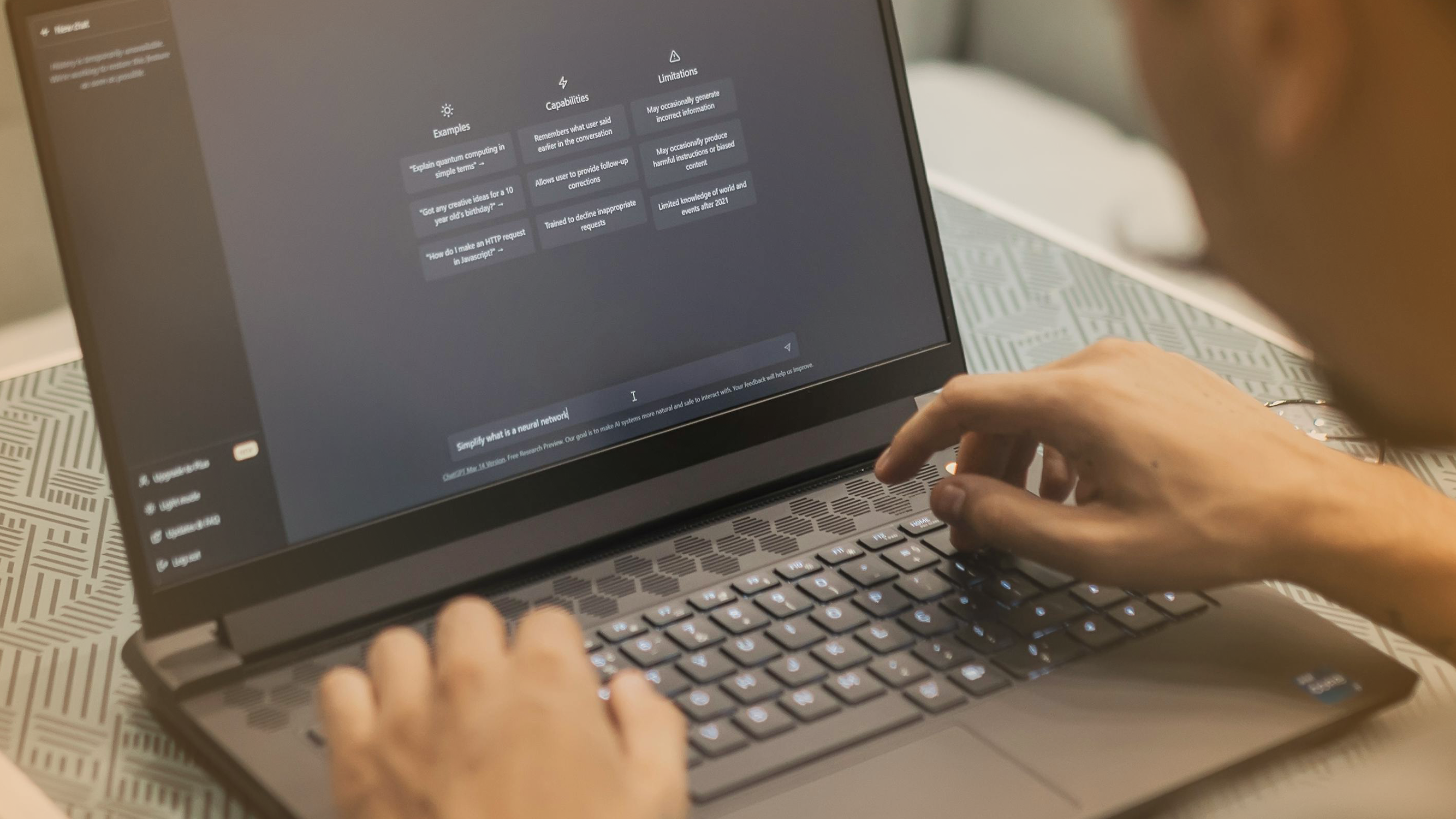 Person using AI chat tool on laptop