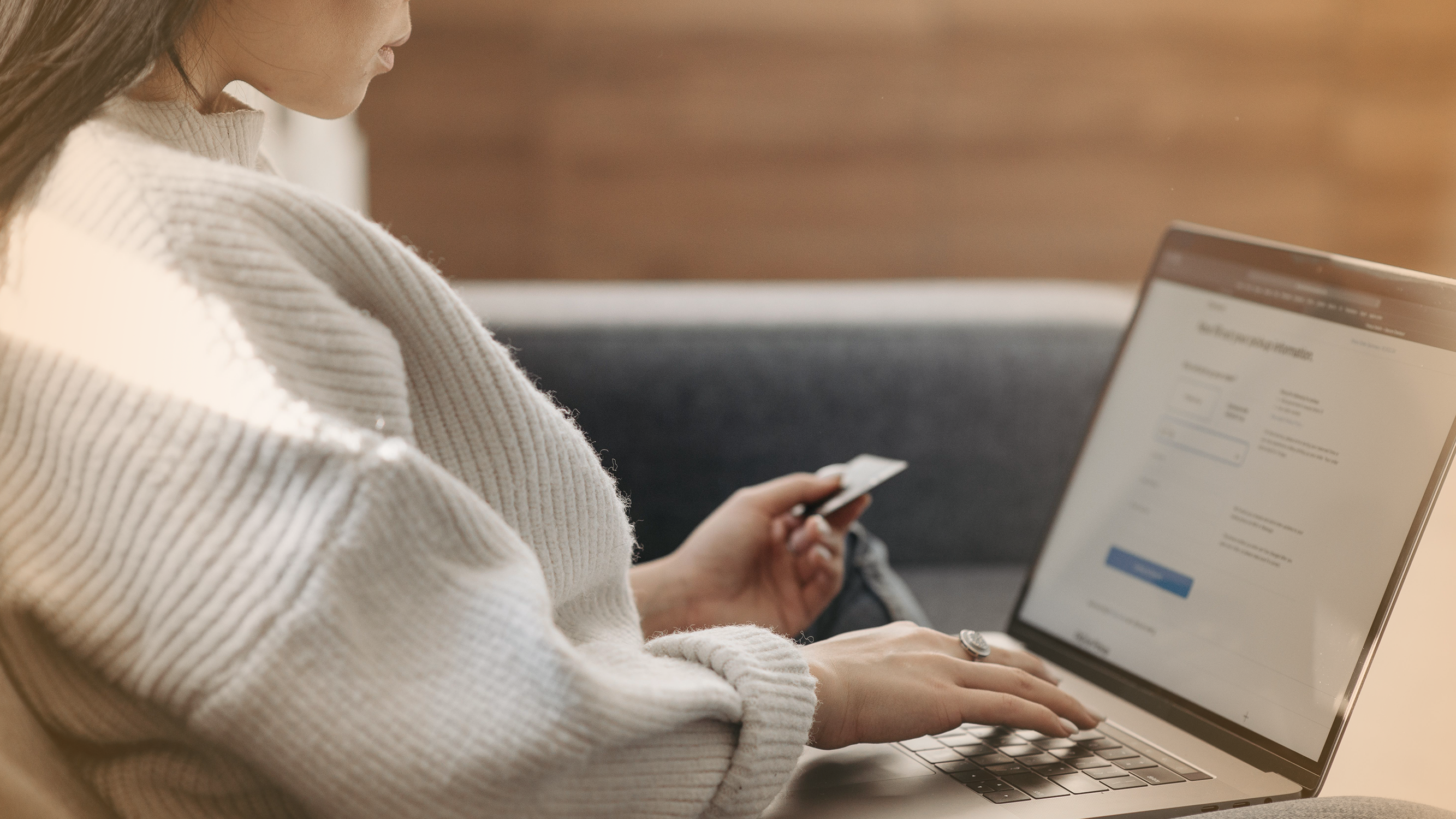 Person looking at a payment information entry form on a website