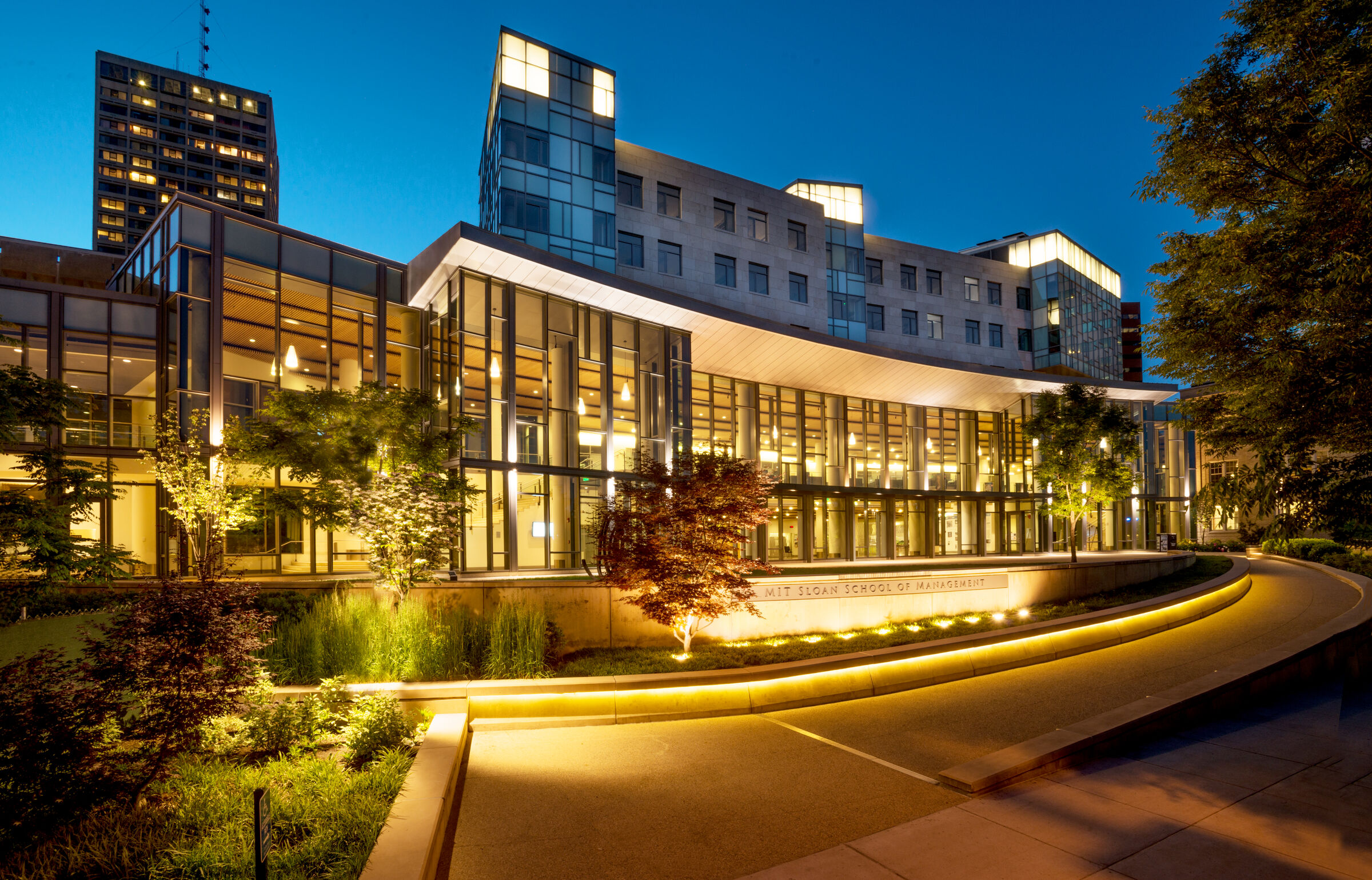 River side of MIT Sloan Building E62 at dusk