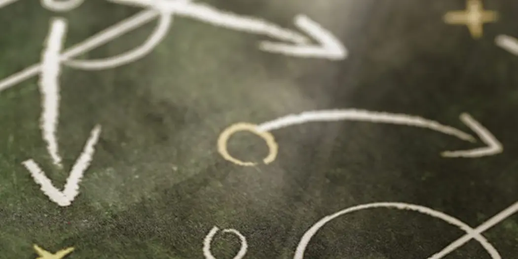 Symbols depicting a play strategy in a sports playbook.