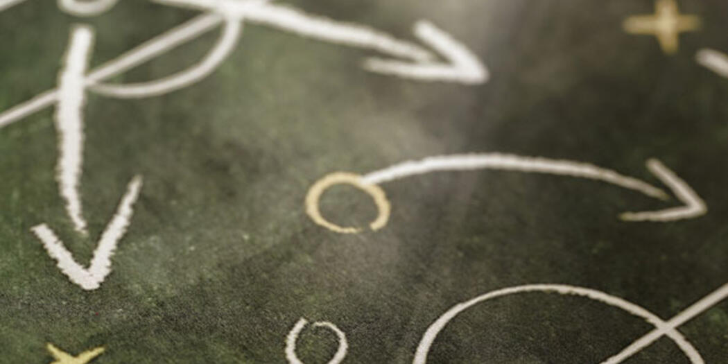 Symbols depicting a play strategy in a sports playbook.