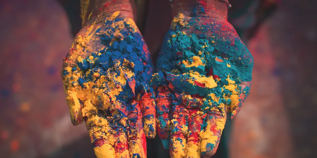 Woman holding color soils
