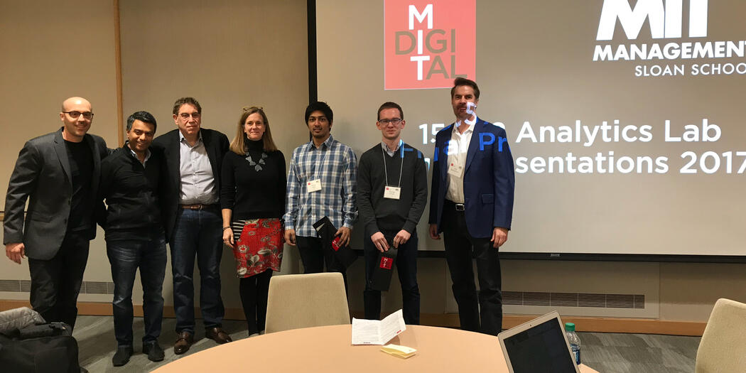 Sinan Aral (far left) and Erik Brynjolfsson (far right), with judges and winning students.