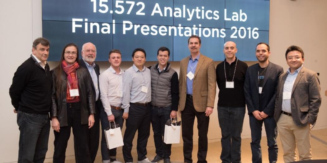Students with course faculty, guest judges, and representatives from the project sponsoring company.