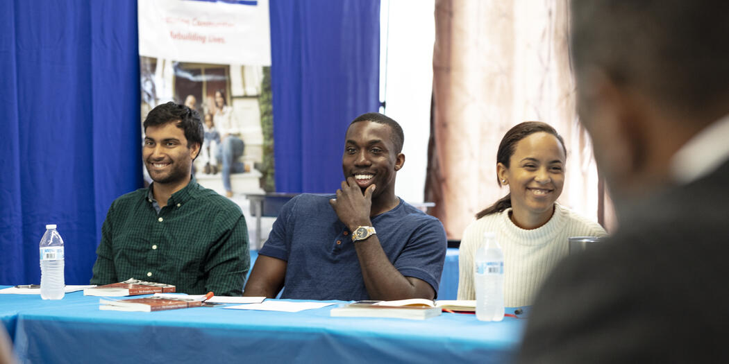 Three USA Lab students sitting at a table