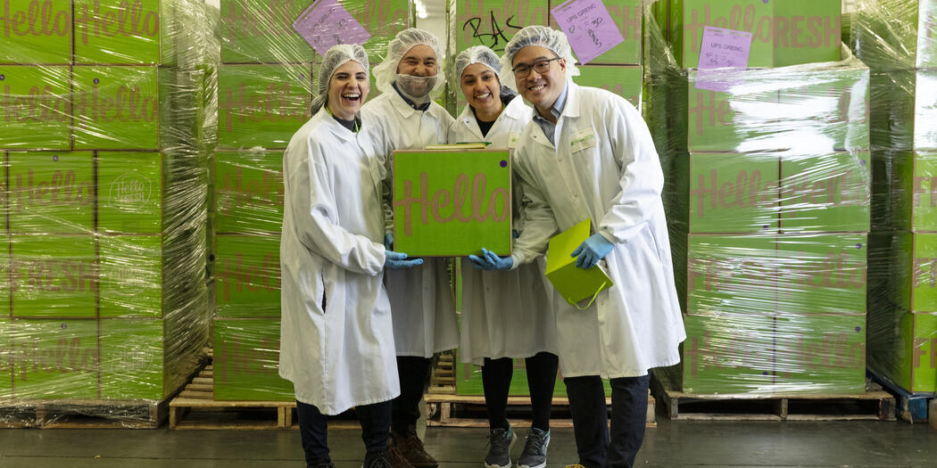 Ops-Lab team holding HelloFresh box with host