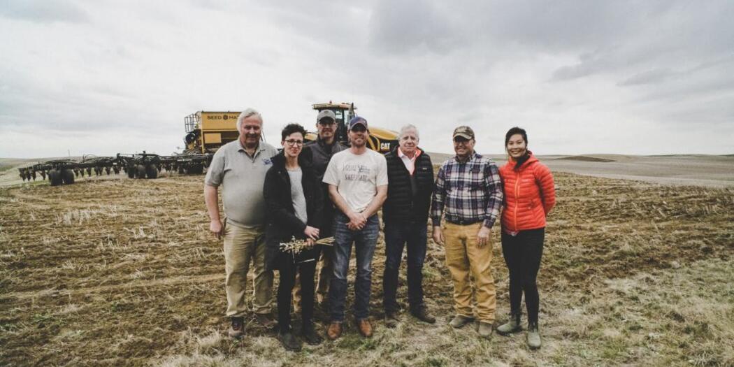 S-Lab students standing in field with hosts.