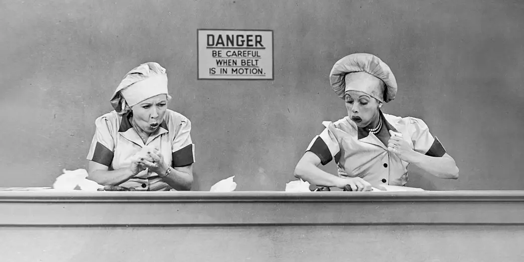 Still of Lucy and Ethel working at the candy factory from I Love Lucy 