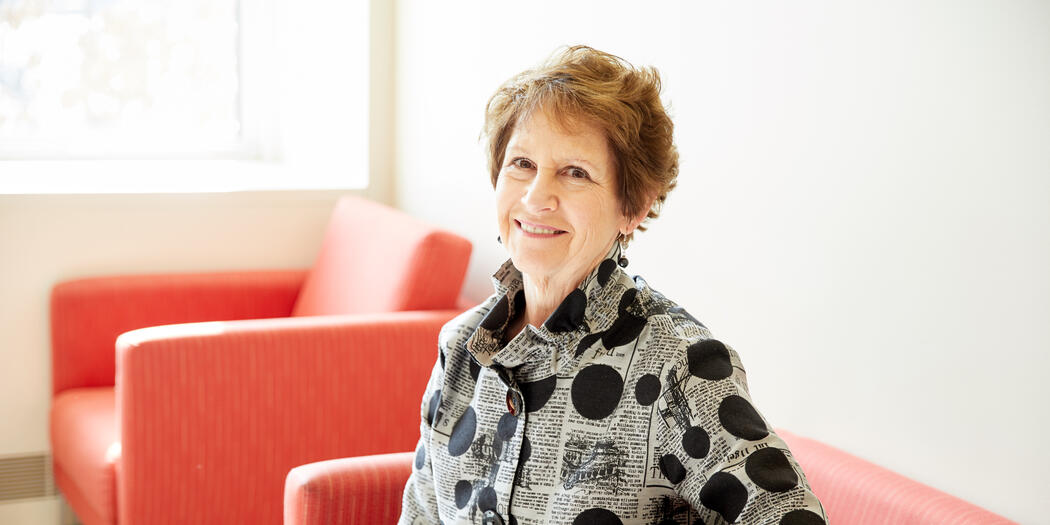 Nancy Van Milligen, CEO and president of the Community Foundation of Greater Dubuque, sitting in red chair