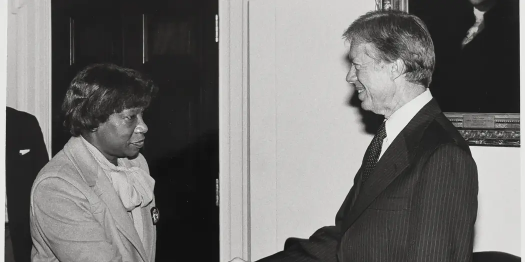Phyllis Wallace shaking hans with President Jimmy Carter in 1979