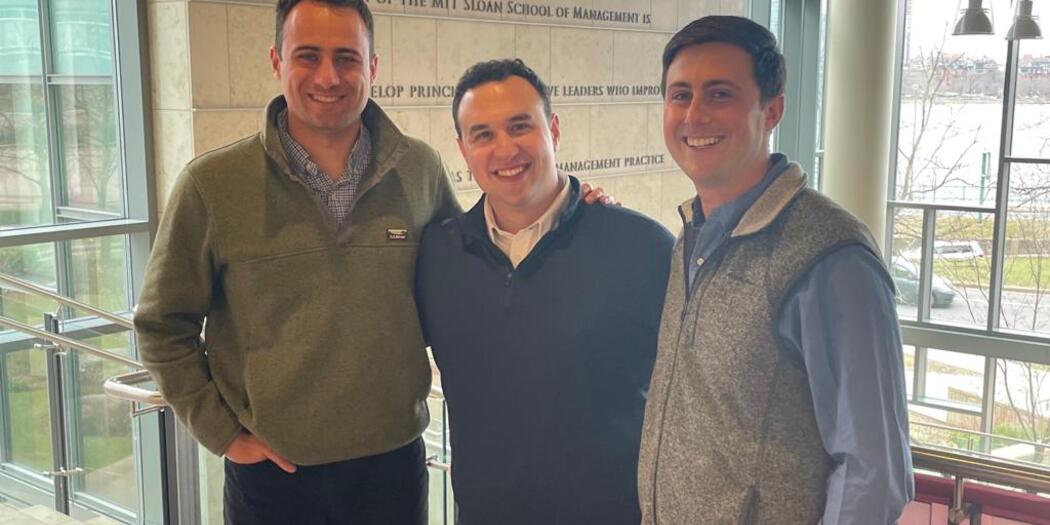 Eric Wainman, Jacob Alchek, and Connor Kozin in the MIT Sloan E62 building