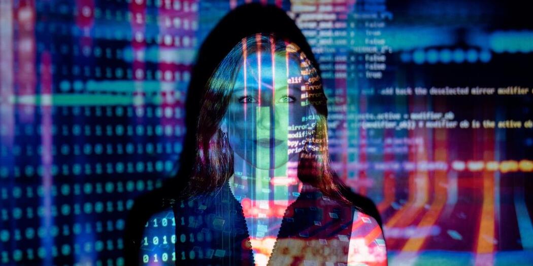 Pixelated imaged of a women in front of an urban landscape