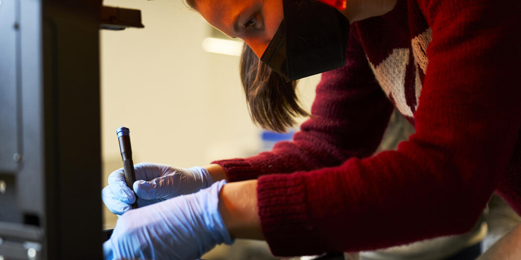 LGO student Lisa Schleuter taking apart 3D printer