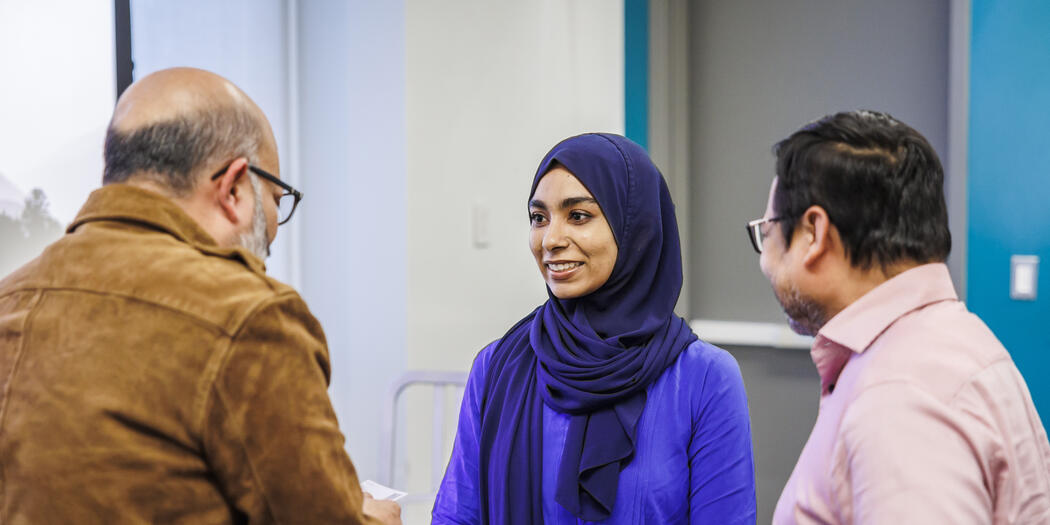 Kamal Quadir speaks with students
