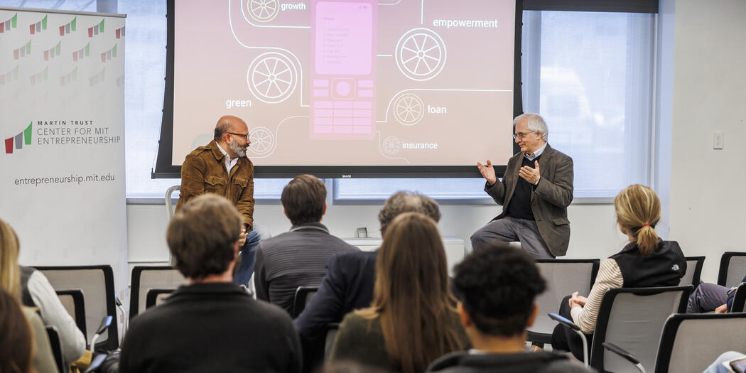 Kamal Quadir and Michael Cusumano chat after the talk