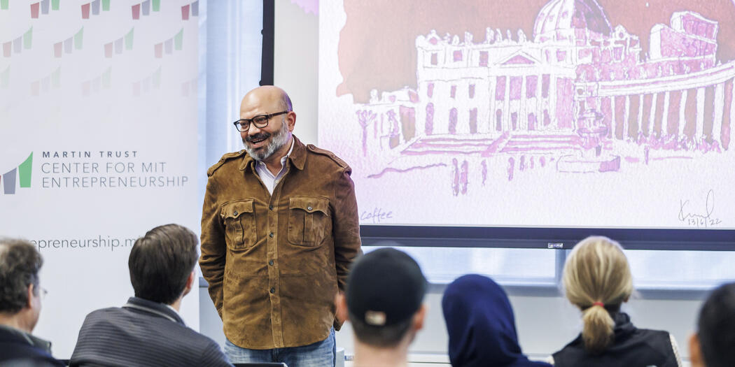 Kamal Quadir poses with his artwork