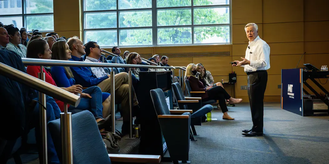 A man addressing an audience.