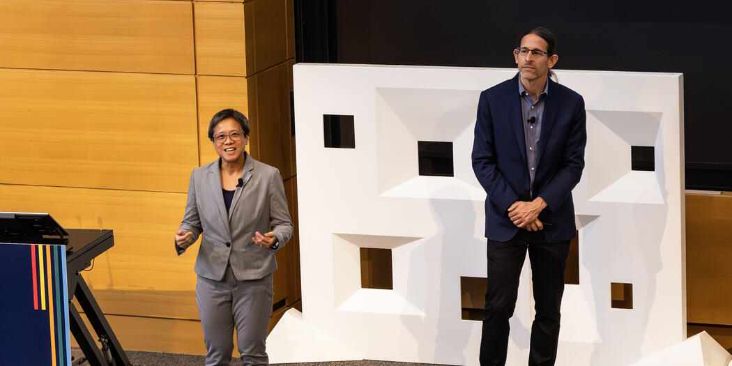 Man and woman addressing a crowd