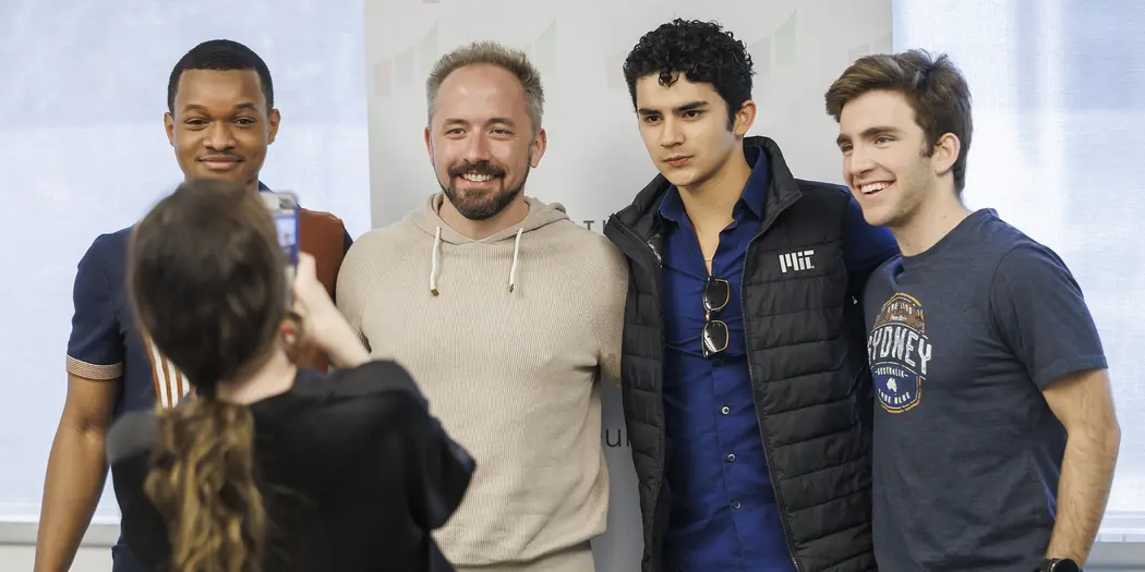 Several people pose for a photo together