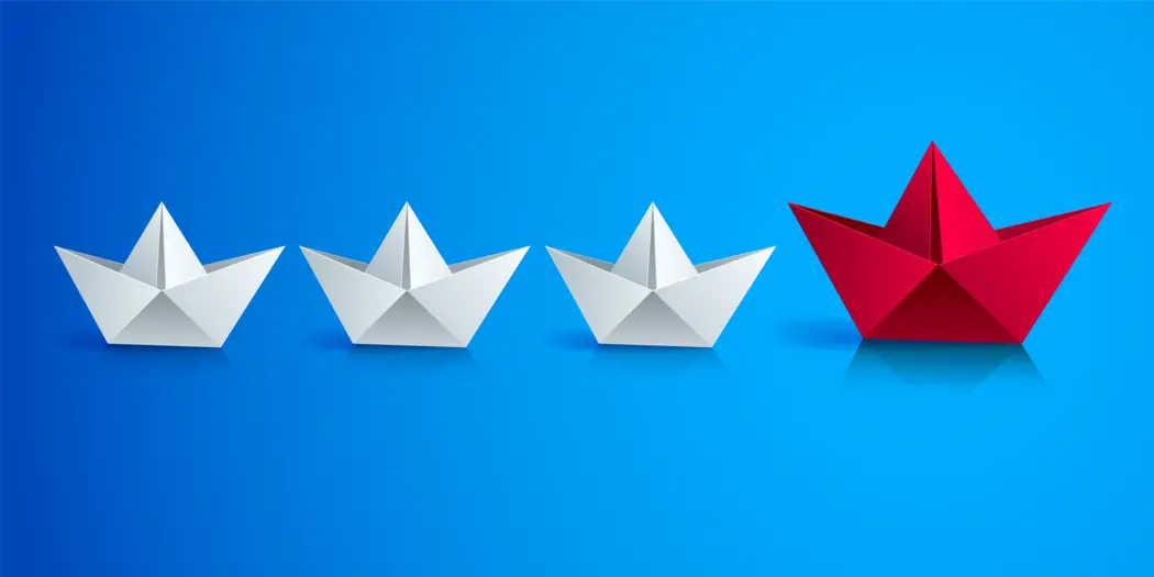 Four paper boats on a blue background
