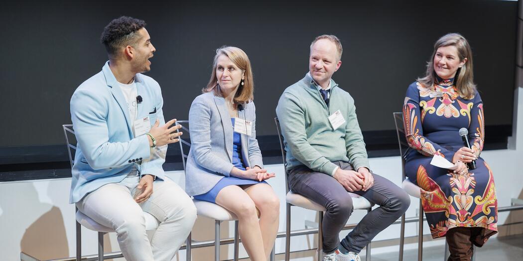 The four event speakers sitting next to one another.