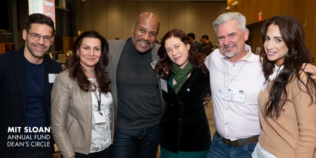 A group of six MIT Sloan alumni pose for a photo at a Deans Circle event