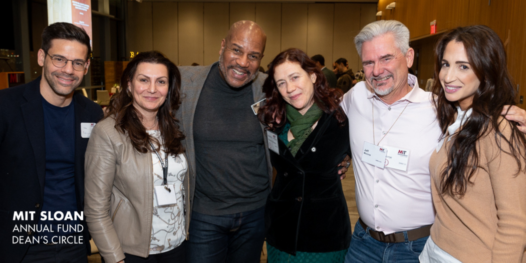 A group of six MIT Sloan alumni pose for a photo at a Deans Circle event
