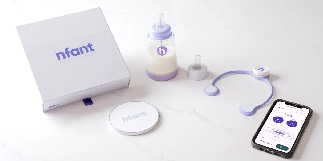 The different components of the nfant Thrive breast product in addition to a cell phone that shows the accompanying app.