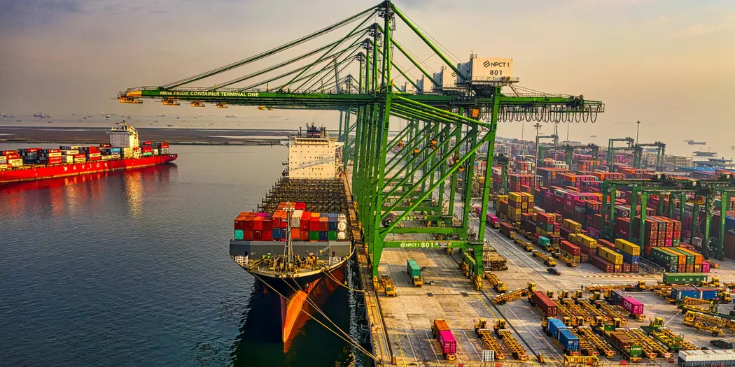 Image of a cargo ship and containers at a port