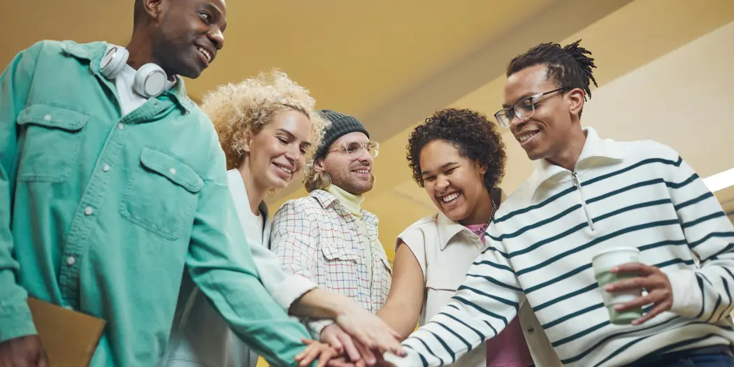 A group of employees celebtrating teamwork