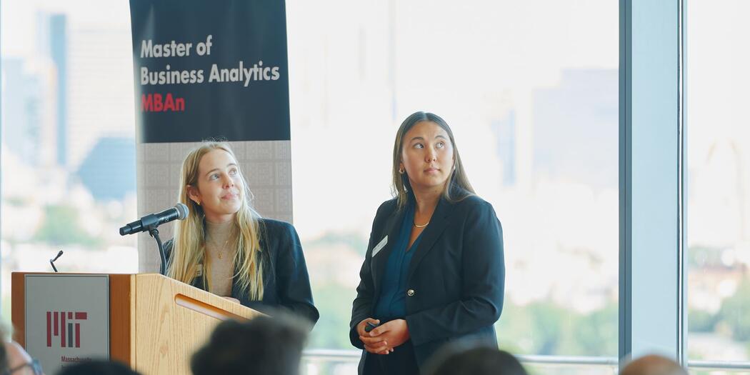Emma Beal, left, and Amelia Whitworth, right, present their MBAn Capstone projects