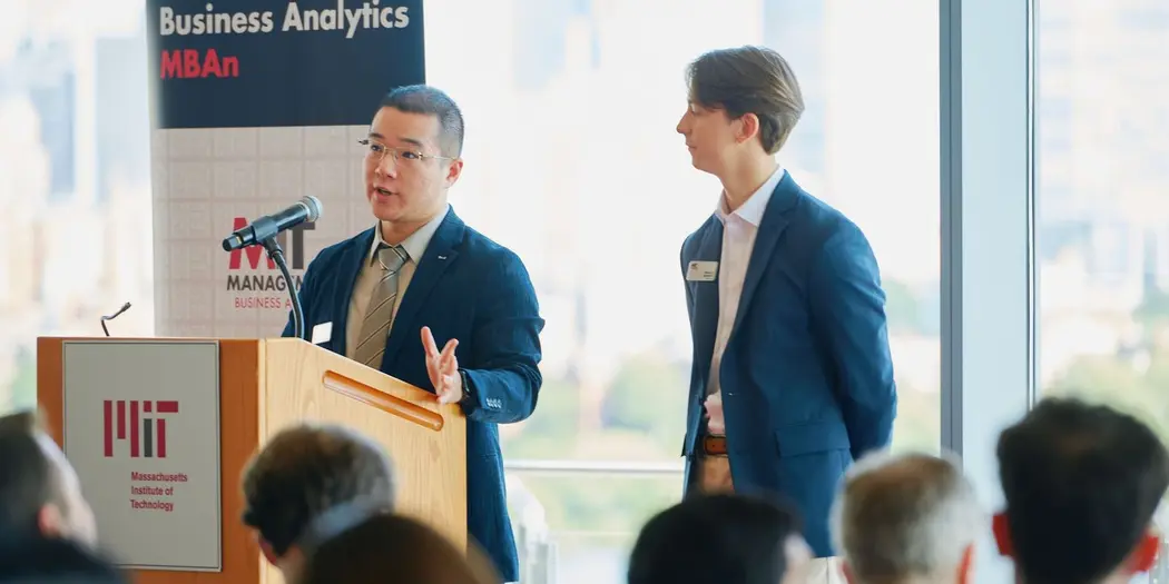 Steve Zhou, left, and Thibault Soubeste, right, present their MBAn Capstone presentation
