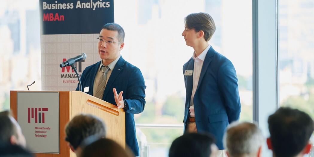 Steve Zhou, left, and Thibault Soubeste, right, present their MBAn Capstone presentation