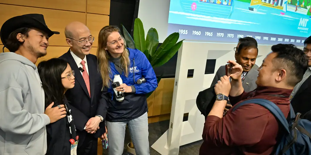 A group of smiling people pose for a photo.