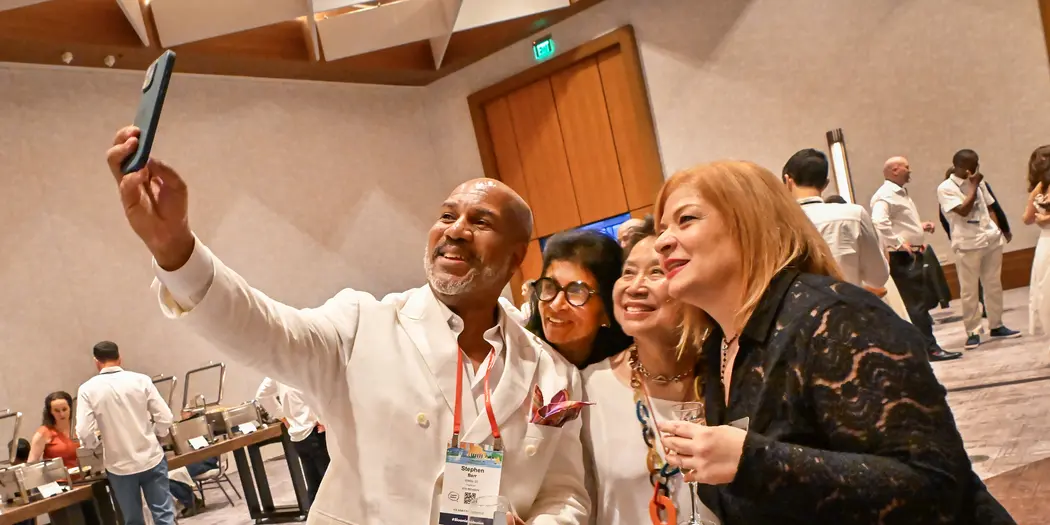 A group of people pose for a selfie.