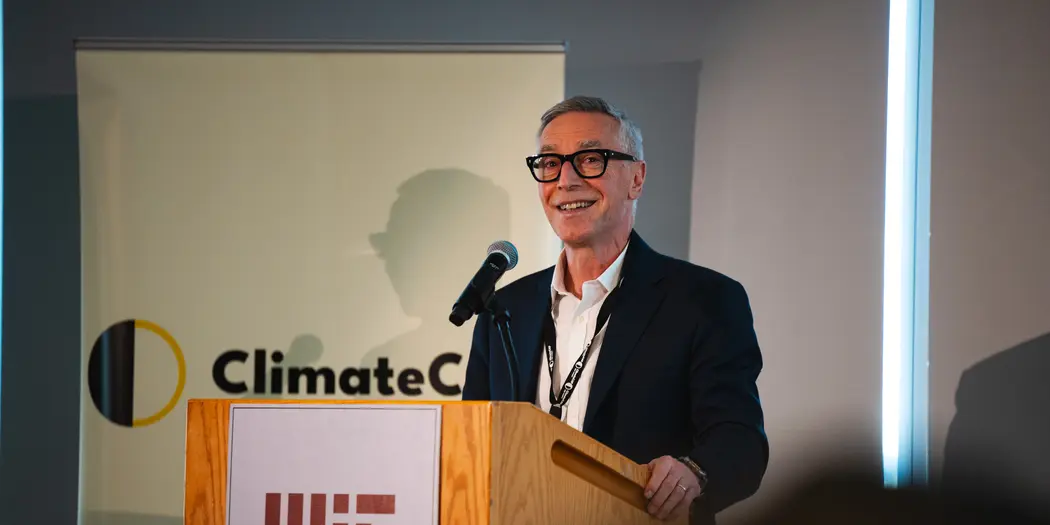 Richard M. Locke stands behind the MIT podium at the Samberg Conference Center