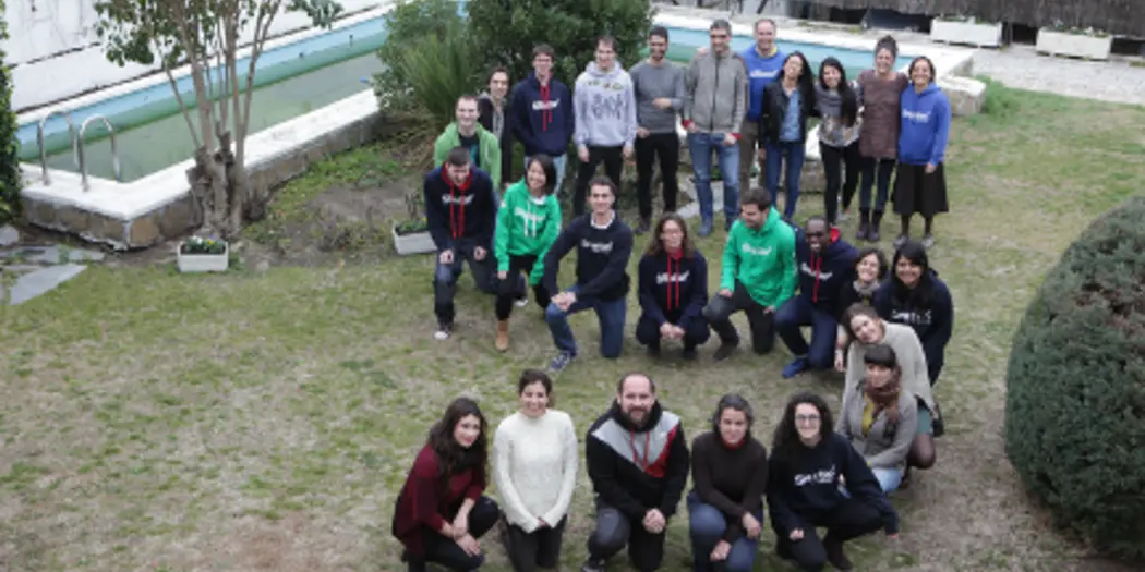 G-Lab students and host posing in the shape of an S