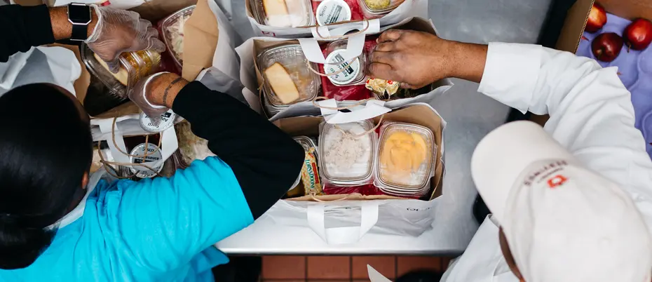 Community Servings workers preparing and packing food