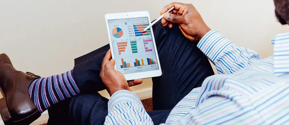 milennial person viewing data visualization/graphs on tablet