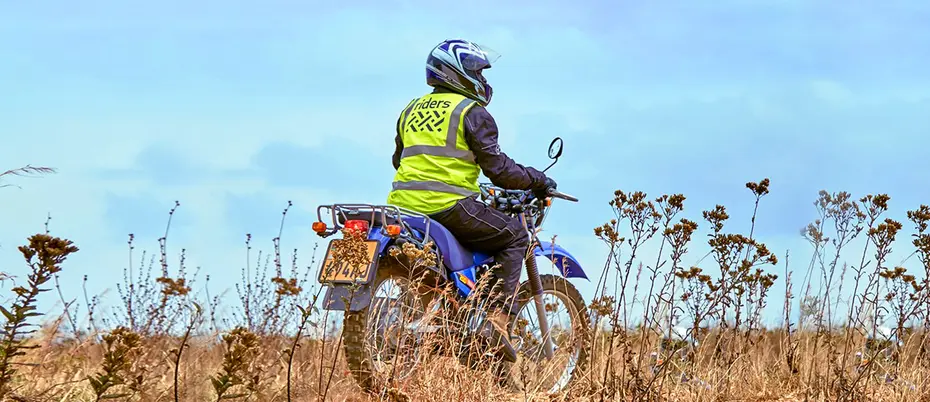Motorcycle rider in field