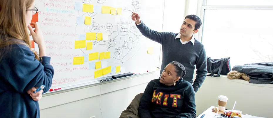 Students solving problem at hackathon