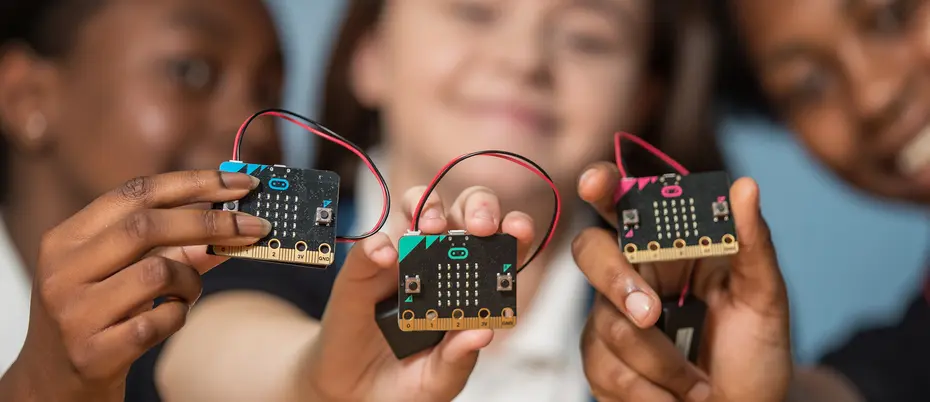 Children holding micro:bit robots