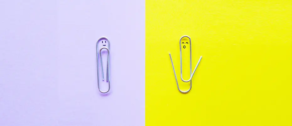 One paperclip is intact and another paperclip is open.